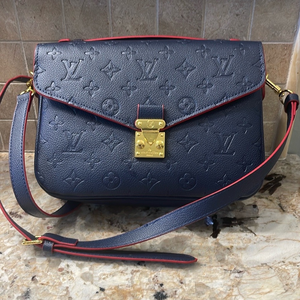 Cross body bag, navy red trim. Very classy